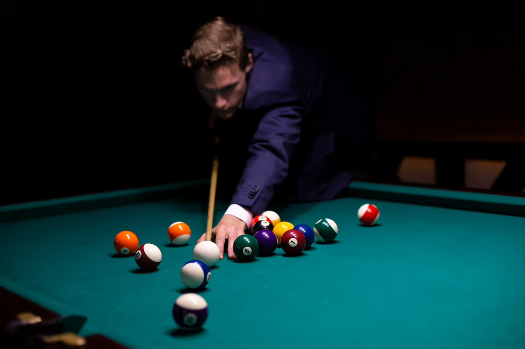 medium-shot-guy-suit-playing-game_23-2148299245 - Cuebera Pool Tables